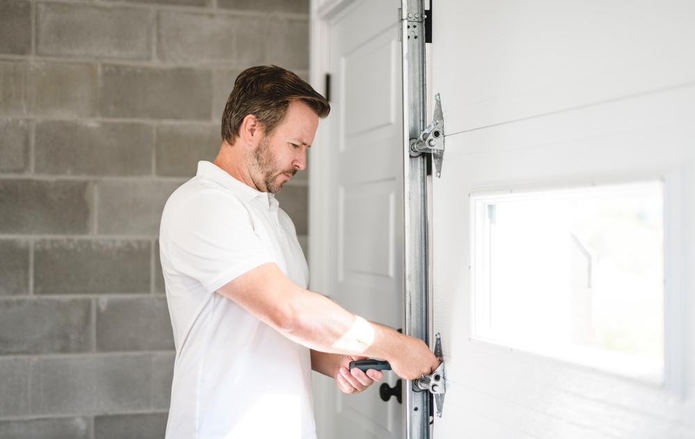 ANiceMenInspectorOrFixingAGarageDoor A nice men inspector or Fixing a garage door