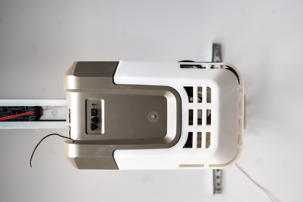 Installation or repair image of a garage door gear motor box with the chain extended.